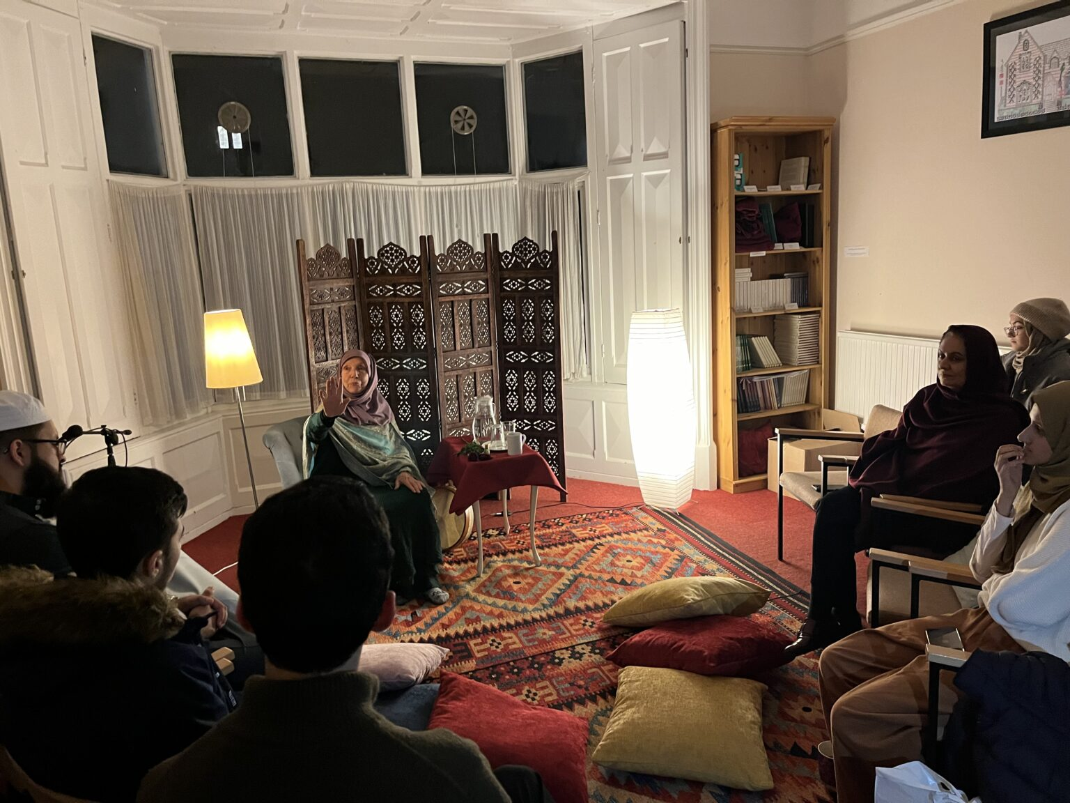 Maryam sharing a story with an audience at Cambridge Muslim College